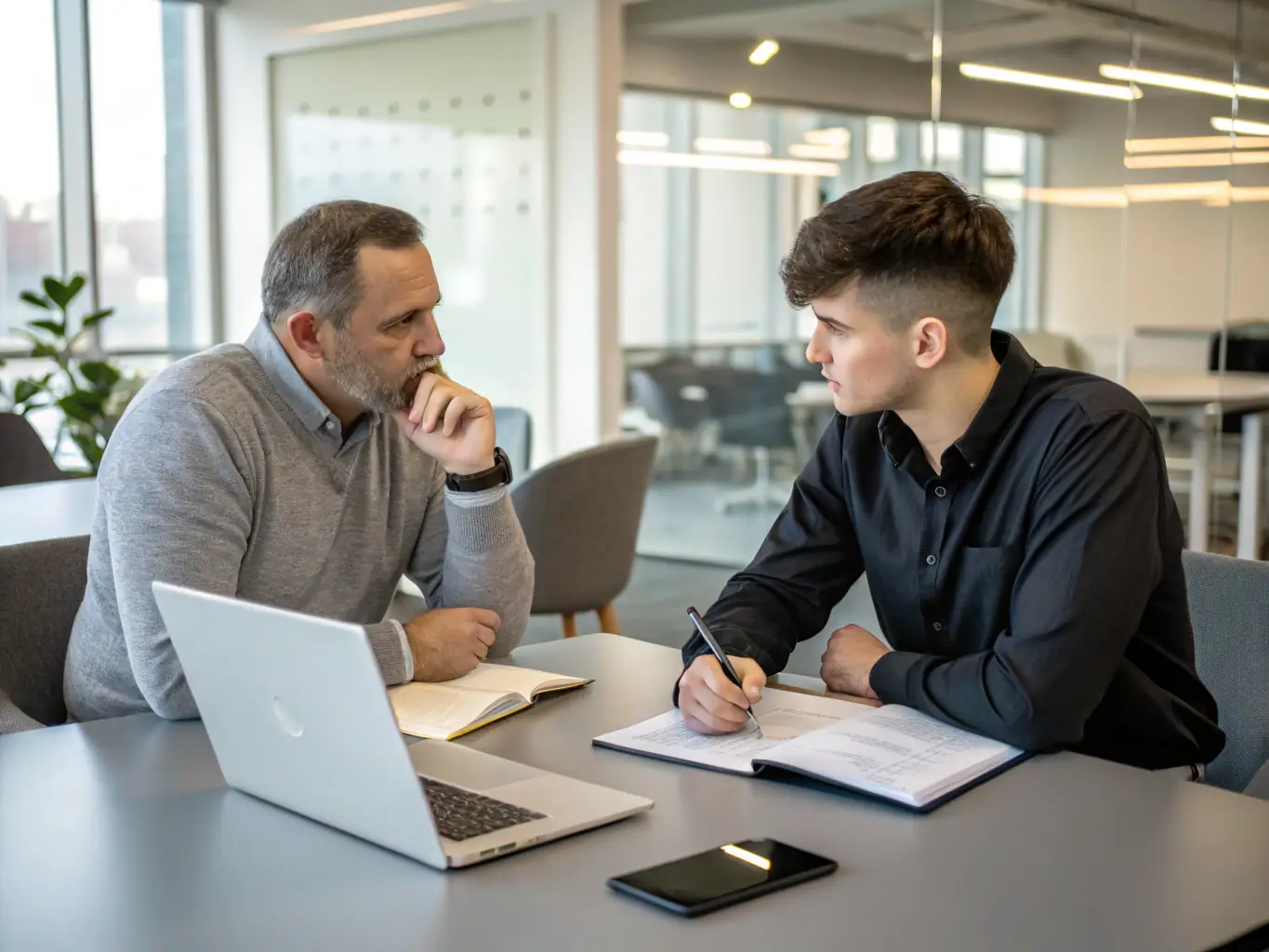 A one-on-one coaching session between a mentor and an executive in a professional office setting, illustrating Ocelotlxyyn's Executive Coaching Sessions.